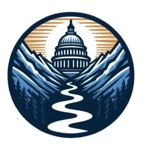 A picture of the capitol building with trees in front.